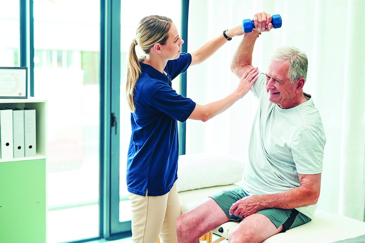 Physiotherapy, fitness and elderly man with nurse help training arm muscle for healthcare, workout and support. Exercise, consulting and medical caregiver stretching senior patient for rehabilitation